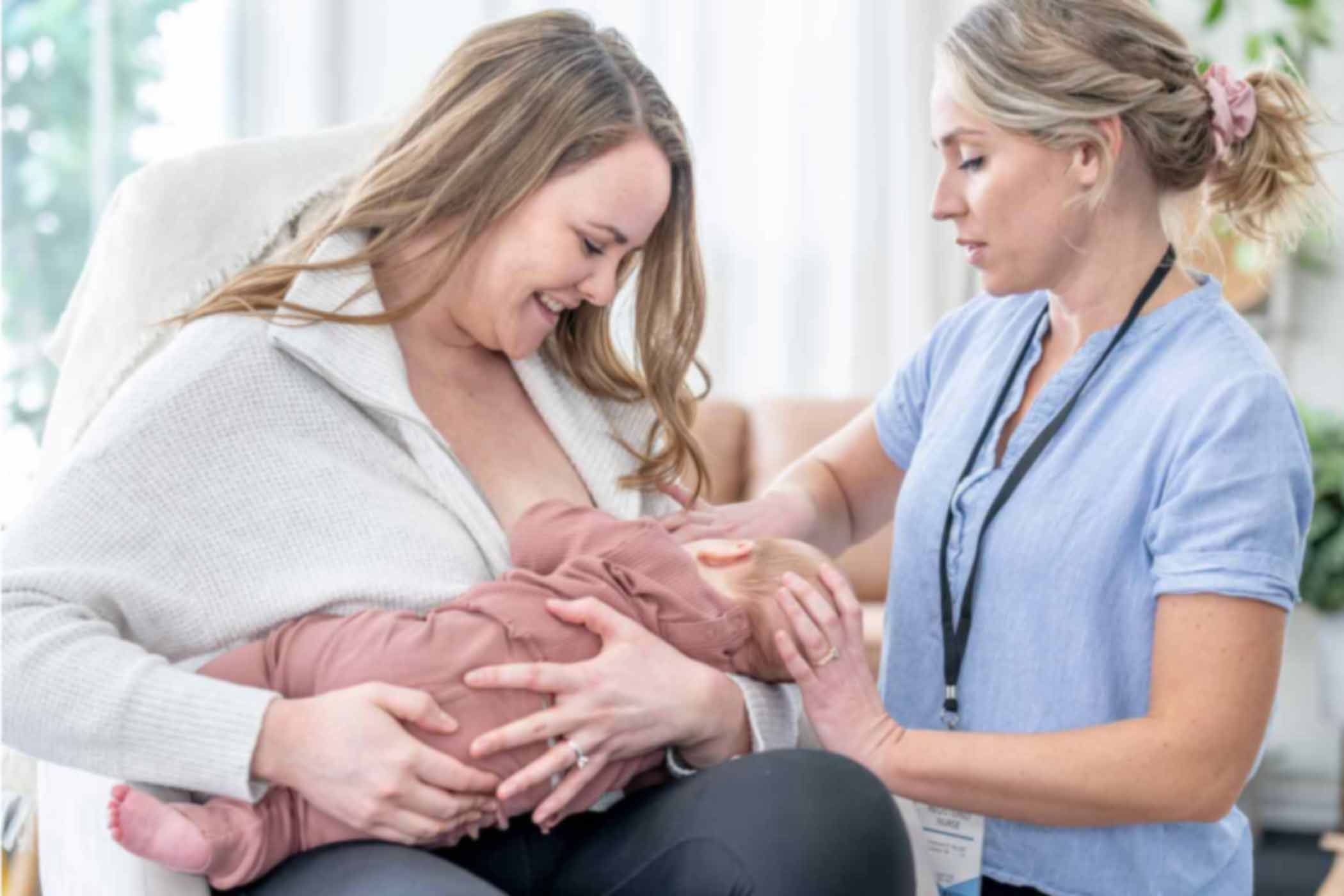 Breastfeeding-Basics-What-Every-HCP-Should-Know mom nursing baby with nurse's help