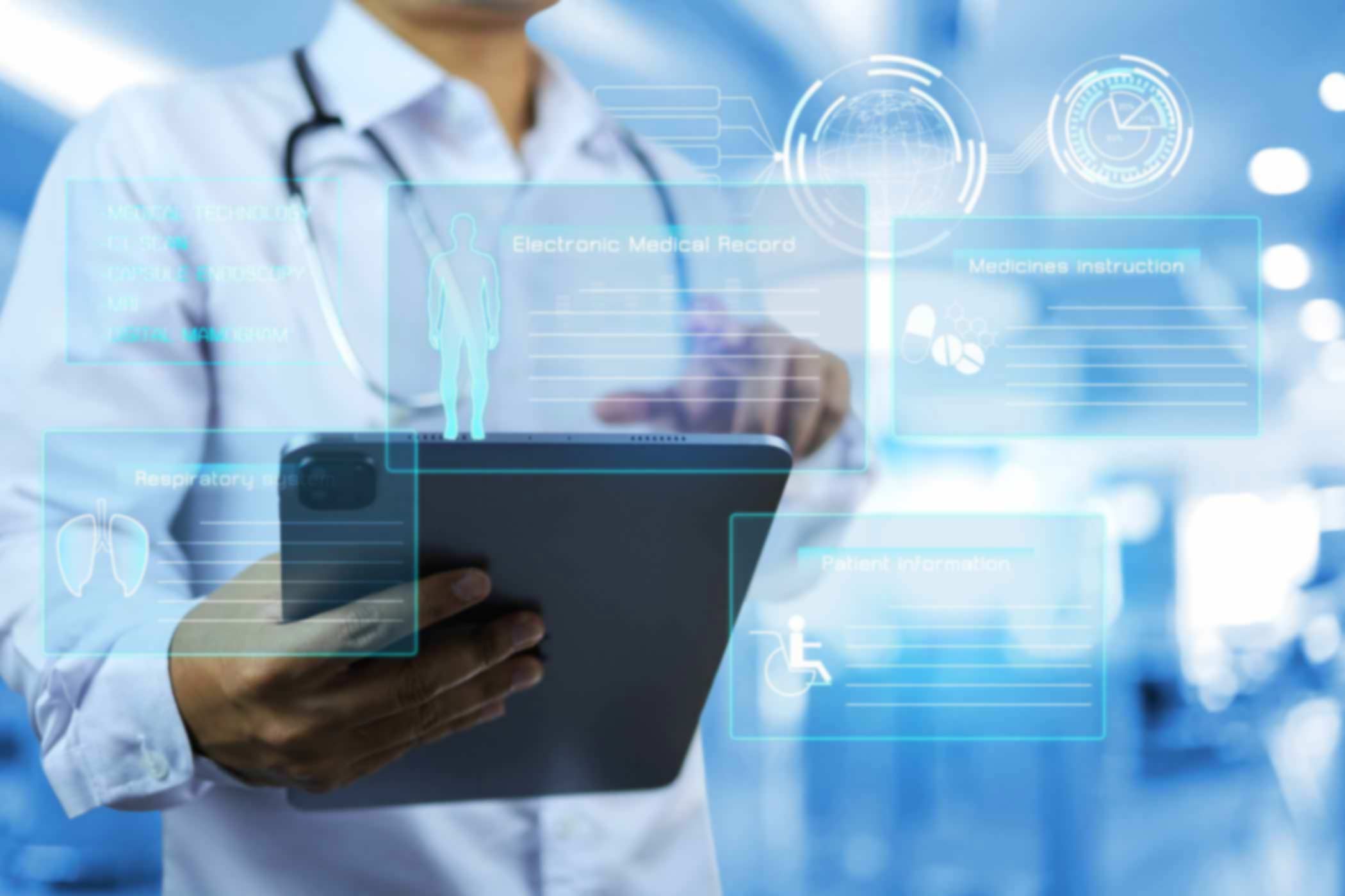 Electronic-Medical-Record-(EMR)-Documentation doctor using a tablet - holographic images on the screen