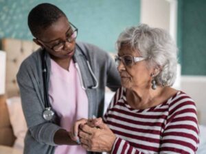 African American nurse with elder patient