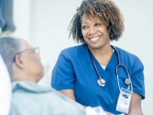 nurse smiling at elder patient